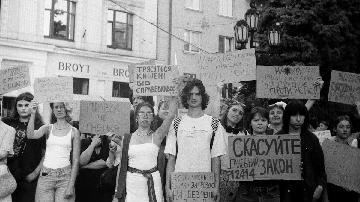 A group of people holding protest signs